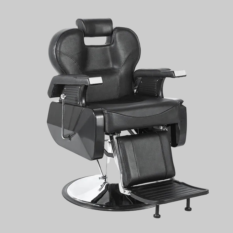 A black leather barber chair with chrome metal base and footrest, shown on a plain white background. 